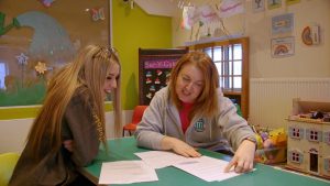 Catrin Morgan and tutor reviewing forms