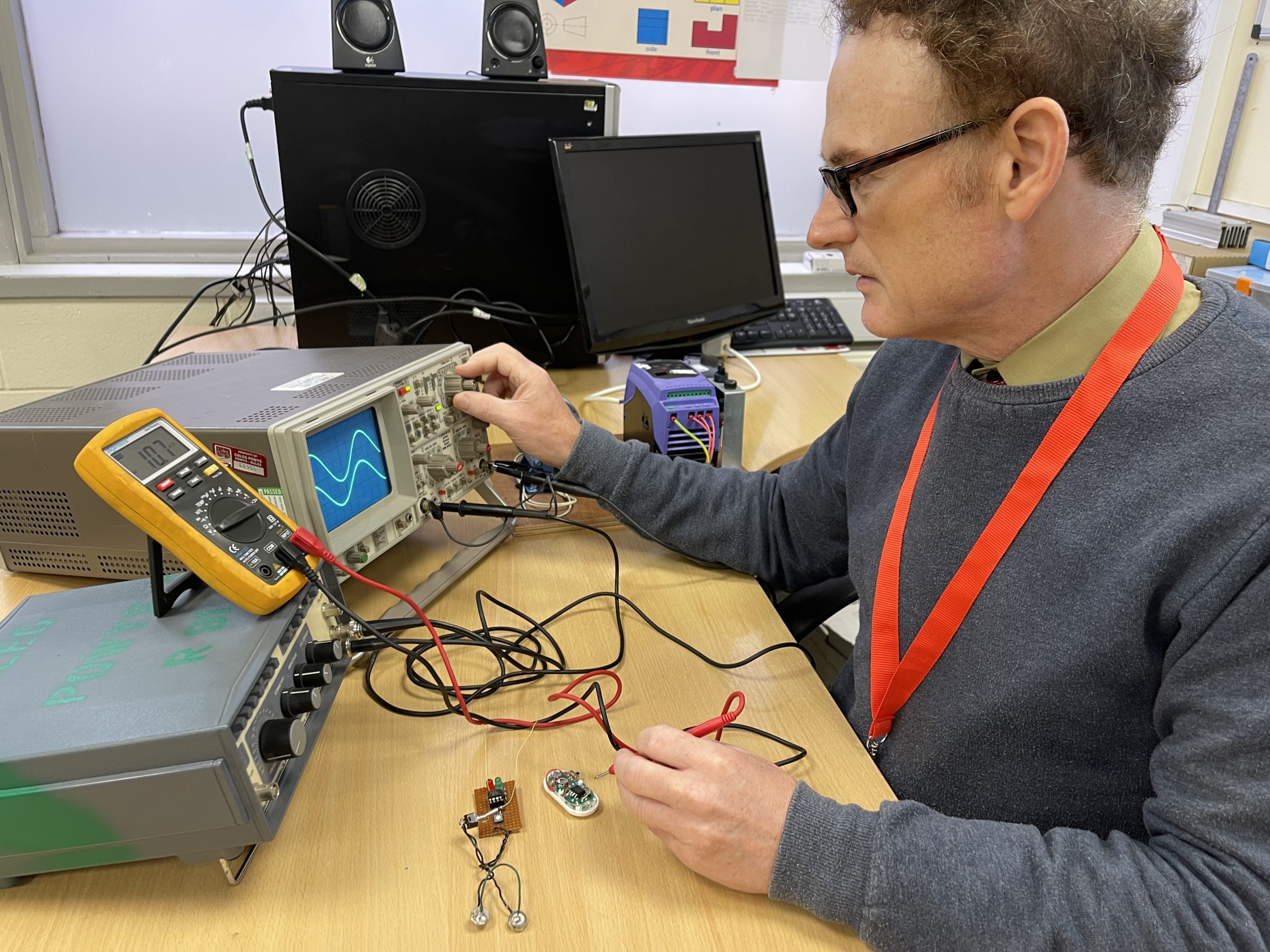 Lecturer Andrew Herbert using electronics equipment.