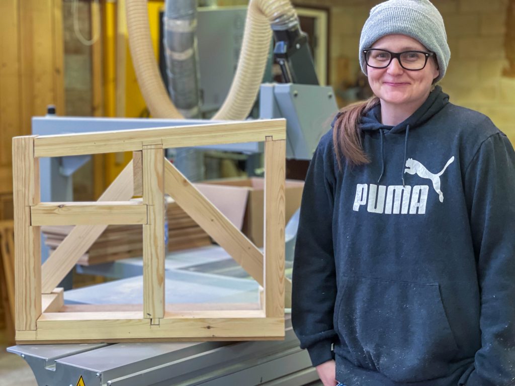 Carpentry student Amy Davison with her woodwork creation.