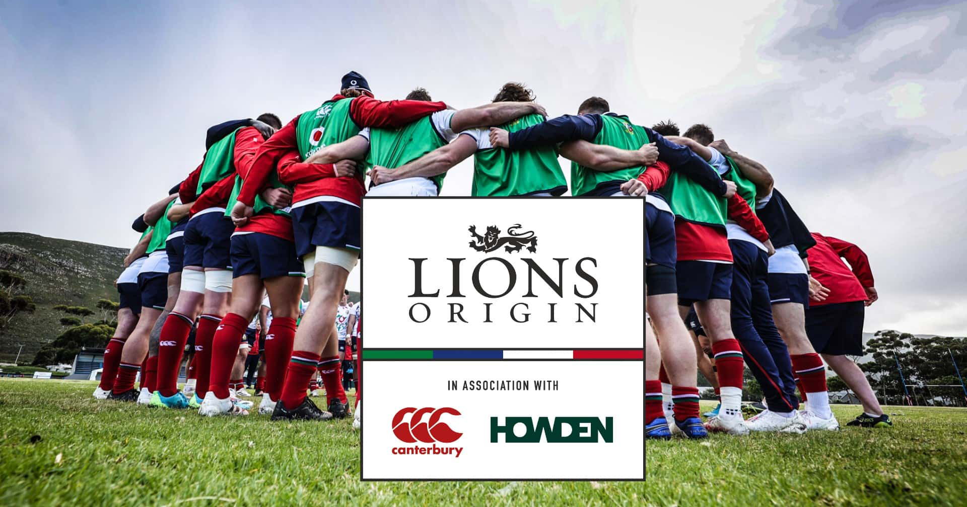 Lions Origin logo with background of rugby players in a huddle. With Canterbury and Howden logos.