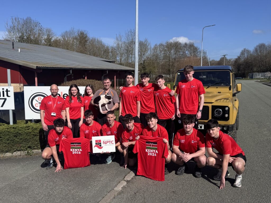Newtown Sports students with their Kenya tour t-shirts, supplied by Richard Morgan from Electric Classic Cars