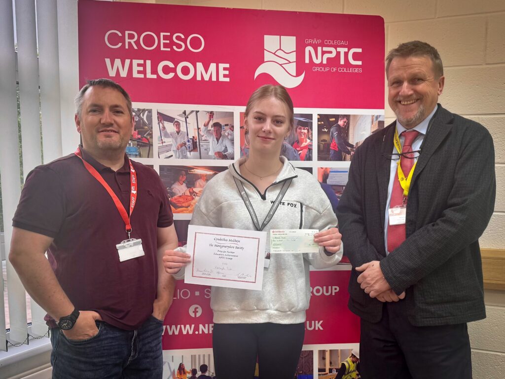 Newtown College Health and Social Care student, Keeleigh Tonks with her lecturers after being awarded the prestigious Montgomeryshire Society Prize for Further Education 2026.